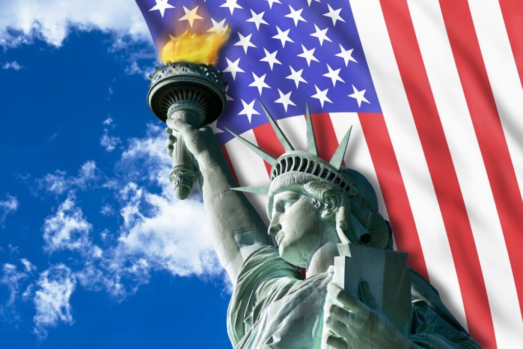 statue of liberty with American flag